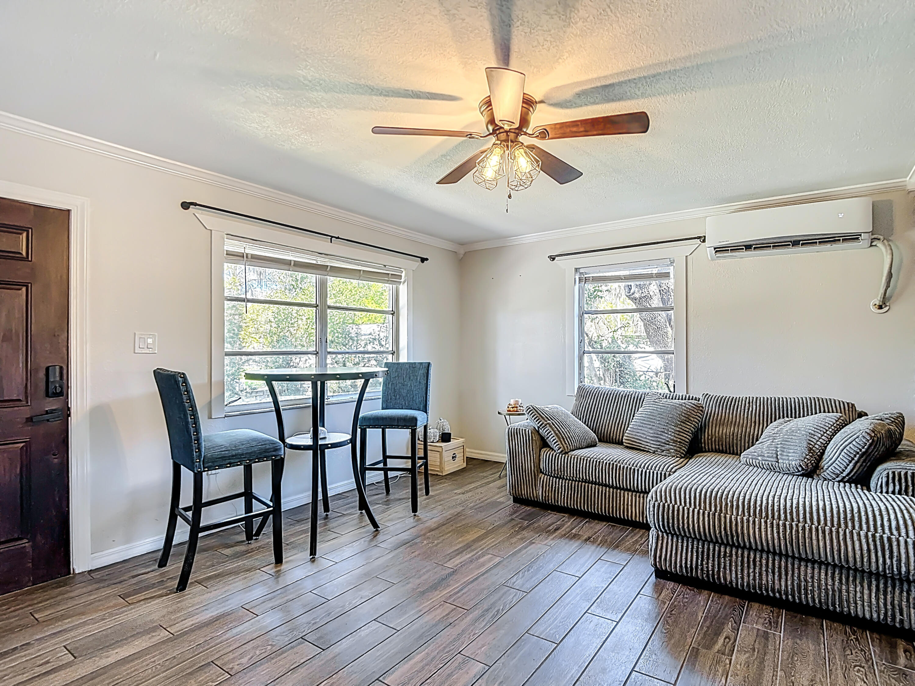 5335 Lemon Avenue Seffner, FL 33584 - Photo 4 of 34 a living room with furniture a wooden floor and a window