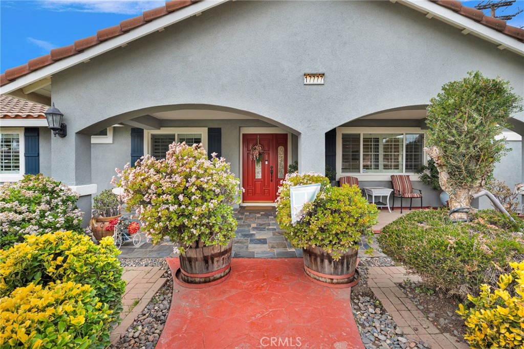 17777 Brazier Drive Riverside, CA 92508 - Photo 8 of 55 a front view of a house with lots of flowers