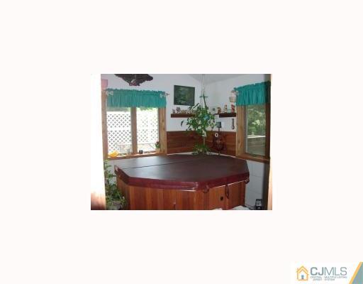 27 MacAfee Road Somerset, NJ 08873 - Photo 3 of 8 a outdoor living space with furniture