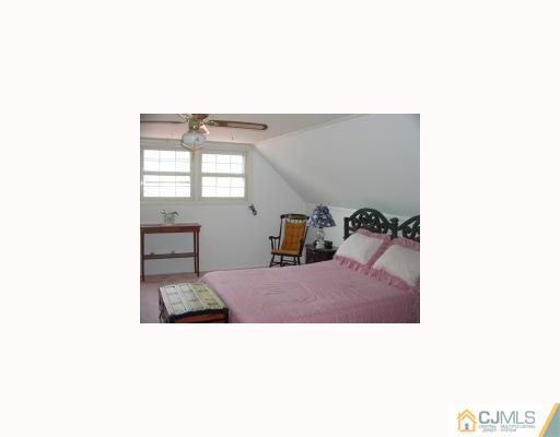 27 MacAfee Road Somerset, NJ 08873 - Photo 6 of 8 a living room with furniture and a window