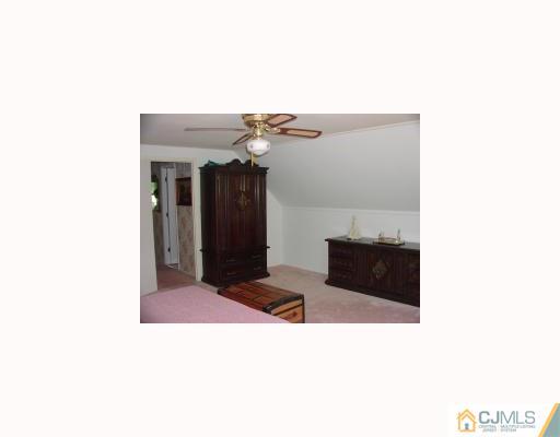 27 MacAfee Road Somerset, NJ 08873 - Photo 7 of 8 a bathroom with a sink and a mirror