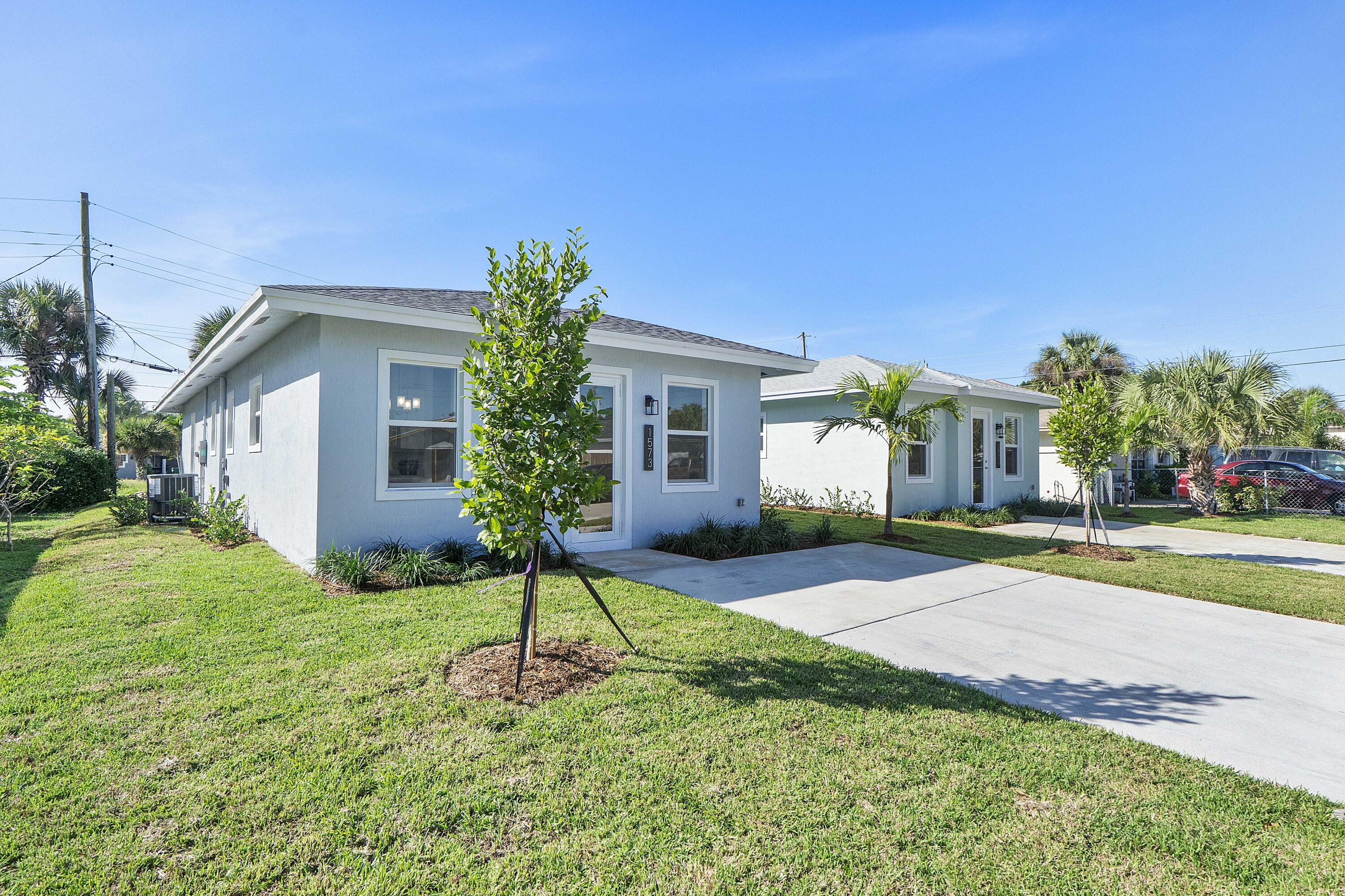 1573 West 16th Street Riviera Beach, FL 33404 - Photo 1 of 23 a view of a house with a patio