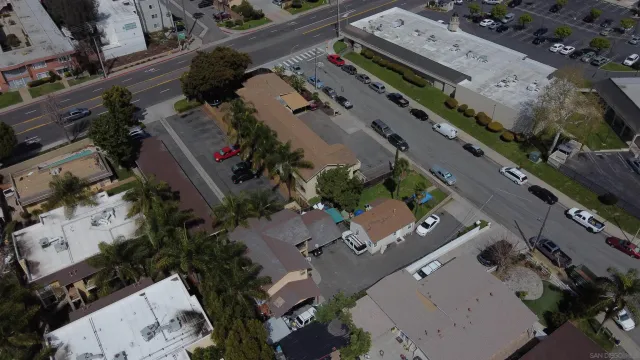 an aerial view of a residential houses with outdoor space