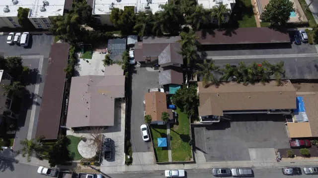 an aerial view of house with yard swimming pool and outdoor seating