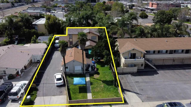 an aerial view of house with swing