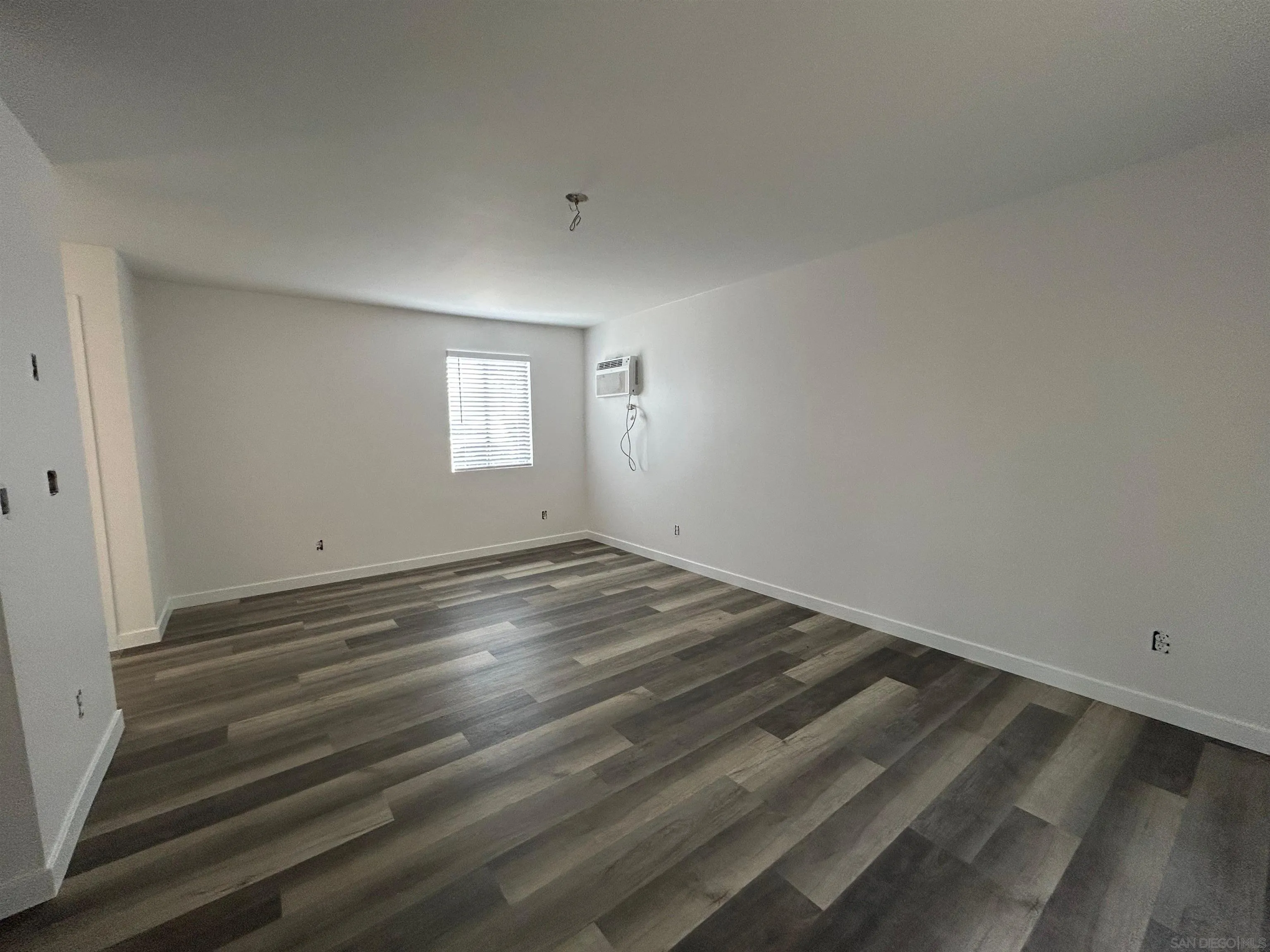 565 North Beech Street Escondido, CA 92025 - Photo 9 of 24 a view of empty room with wooden floor and fan