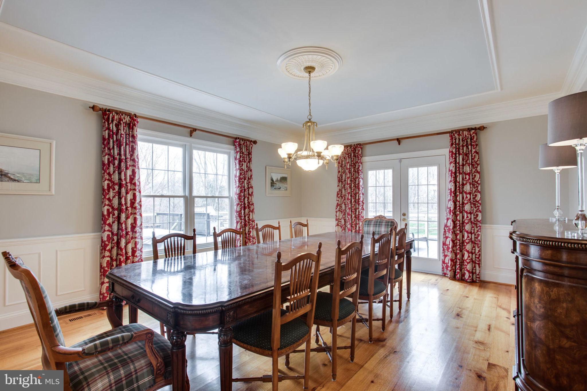 18621 Thundercloud Road Boyds, MD 20841 - Photo 12 of 83 a view of a a dining room with furniture window and wooden floor