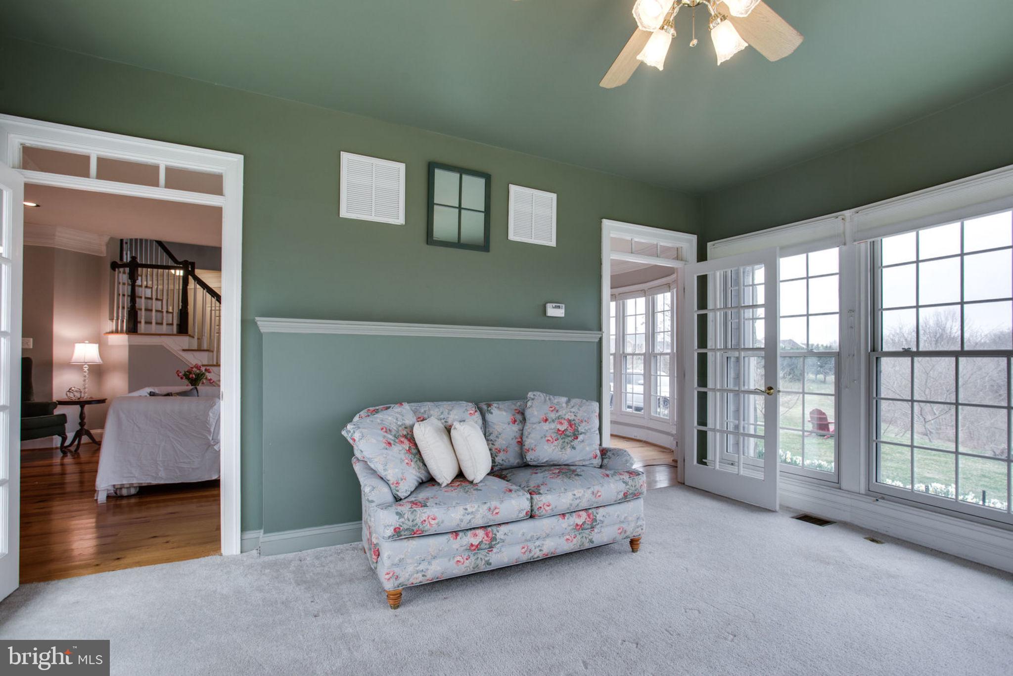 18621 Thundercloud Road Boyds, MD 20841 - Photo 17 of 83 a living room with furniture and a chandelier