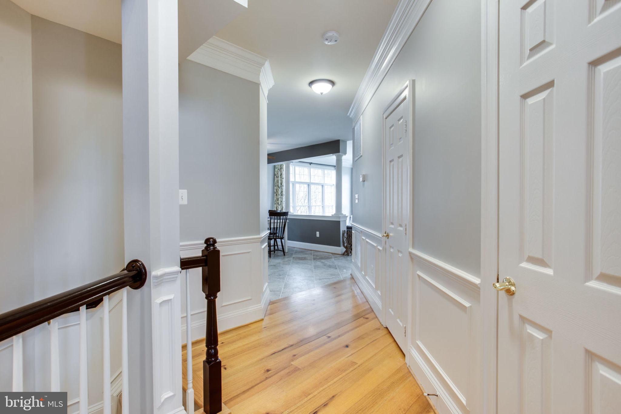 18621 Thundercloud Road Boyds, MD 20841 - Photo 18 of 83 a view of a hallway with wooden floor and staircase