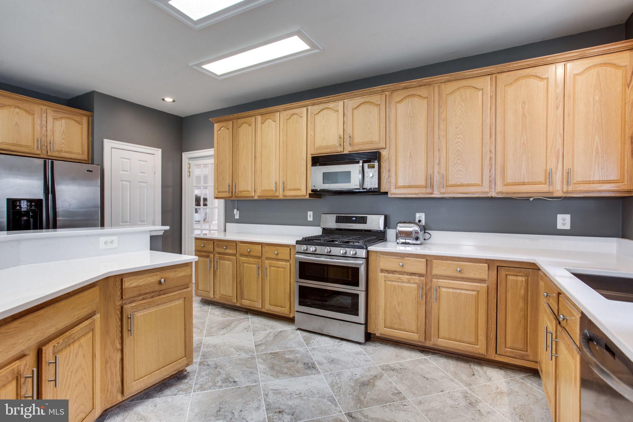 18621 Thundercloud Road Boyds, MD 20841 - Photo 22 of 83 a kitchen with cabinets appliances and a window
