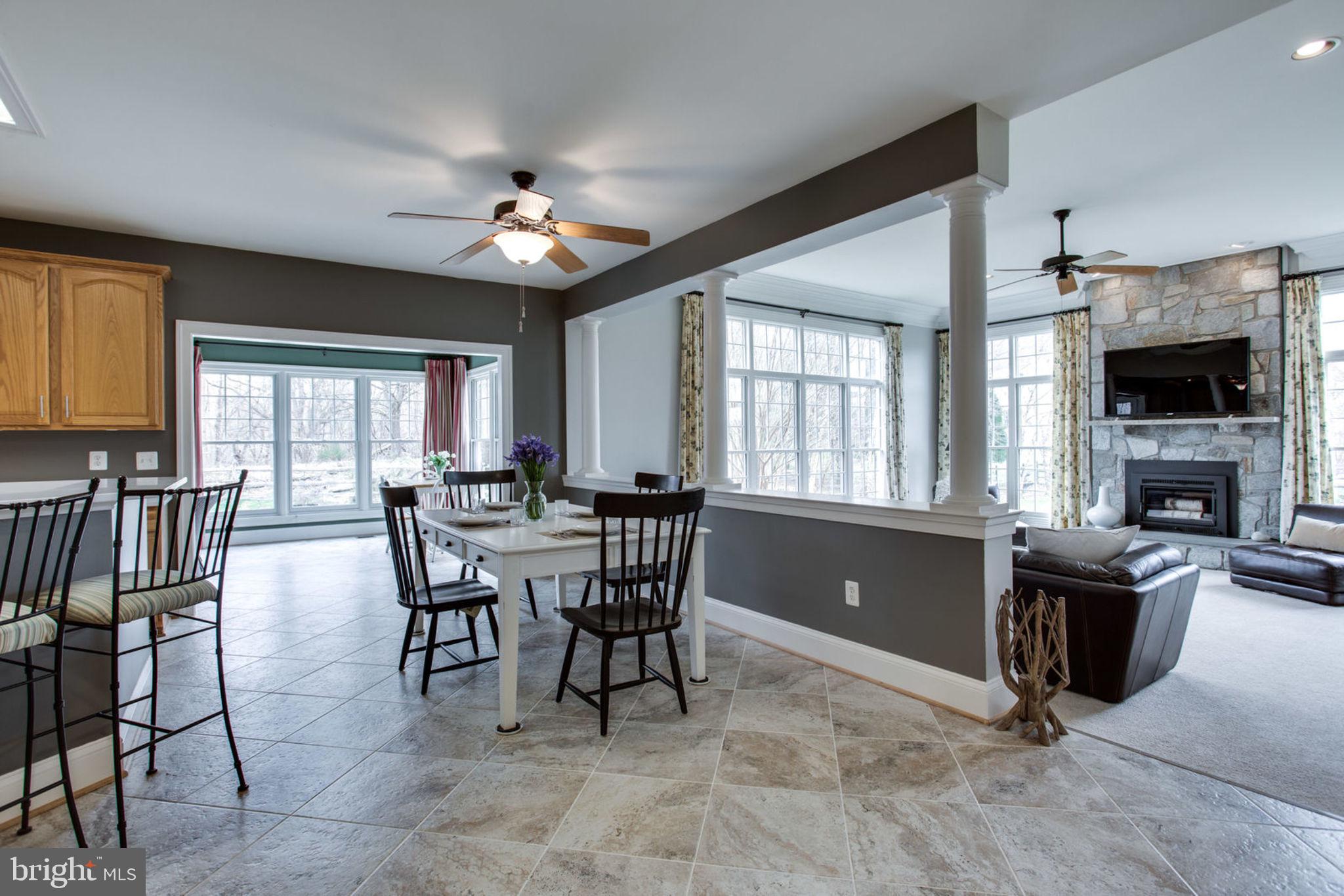 18621 Thundercloud Road Boyds, MD 20841 - Photo 27 of 83 a view of a livingroom with furniture and a ceiling fan