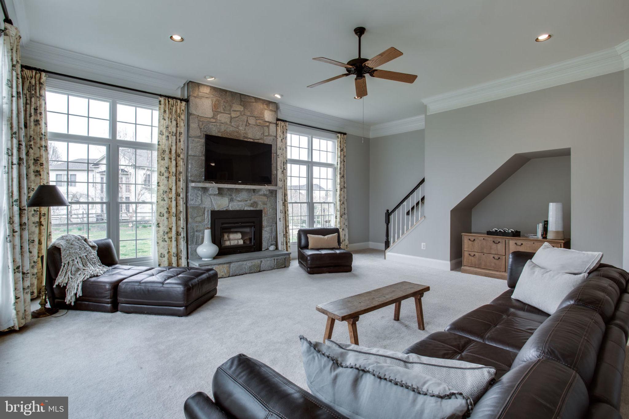 18621 Thundercloud Road Boyds, MD 20841 - Photo 29 of 83 a living room with furniture fireplace and window