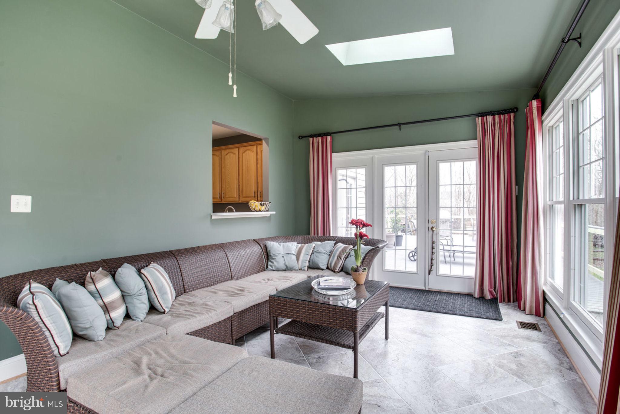 18621 Thundercloud Road Boyds, MD 20841 - Photo 32 of 83 a living room with furniture and a large window