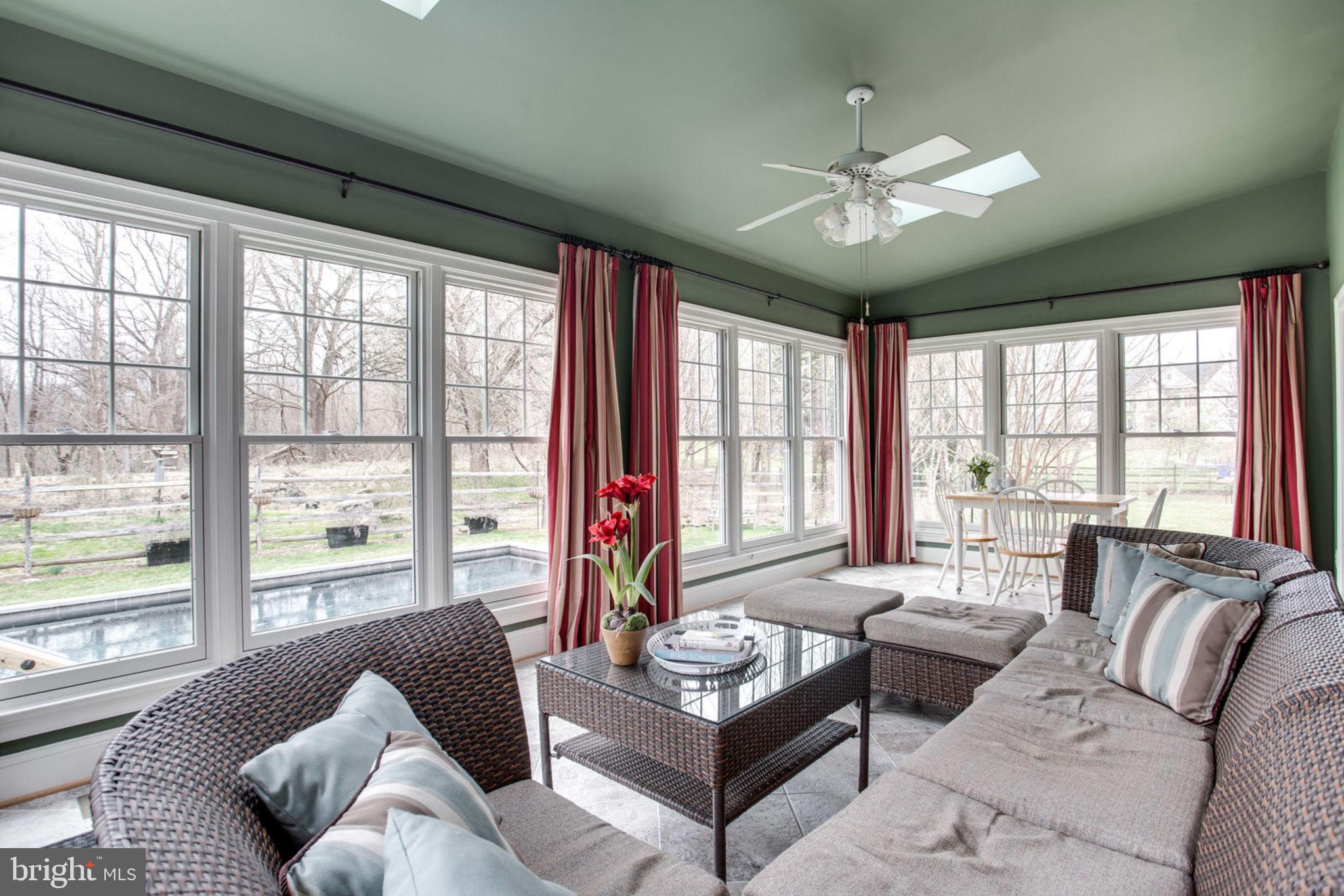 18621 Thundercloud Road Boyds, MD 20841 - Photo 34 of 83 a living room with furniture and large windows