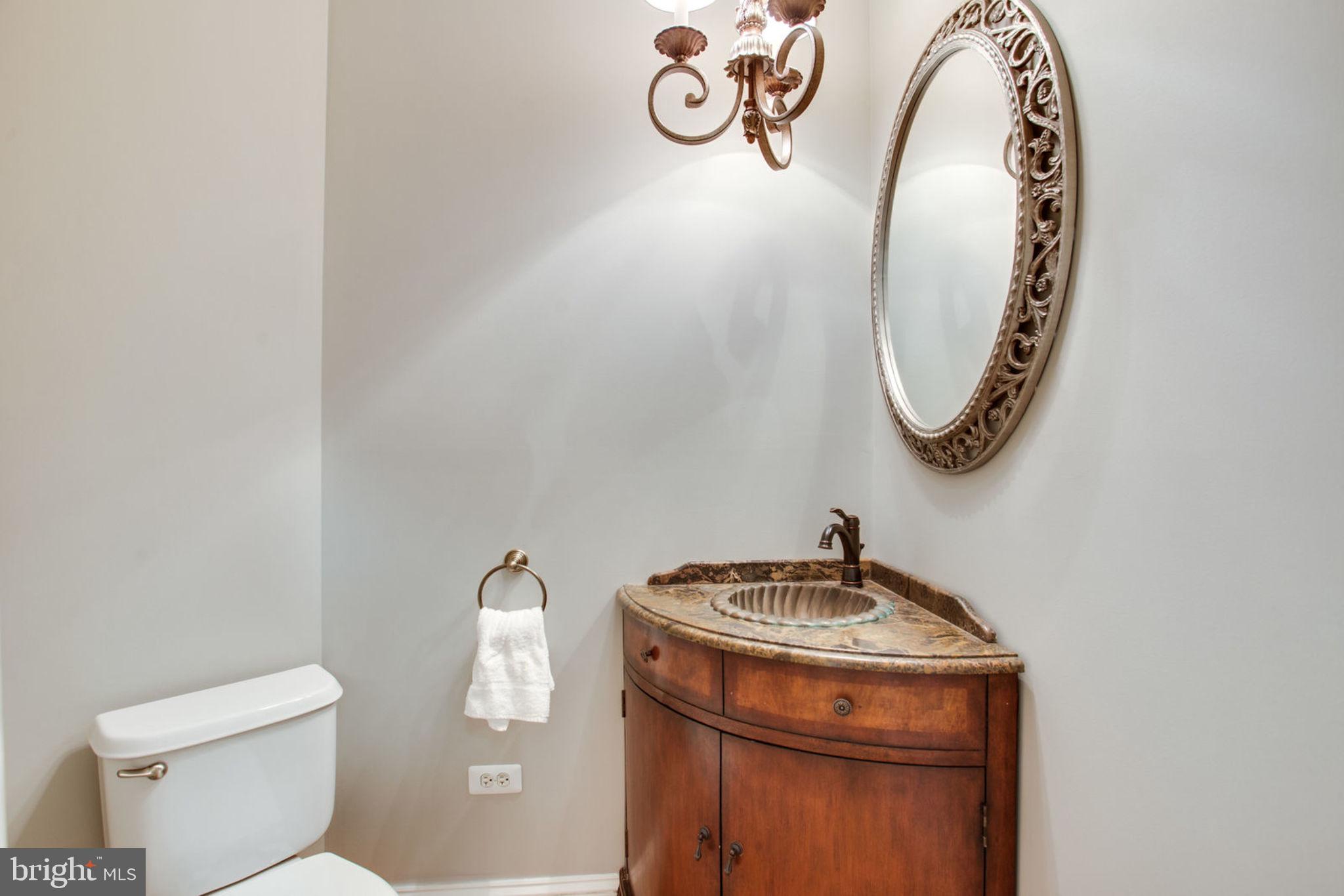 18621 Thundercloud Road Boyds, MD 20841 - Photo 35 of 83 a bathroom with a toilet a sink and a mirror