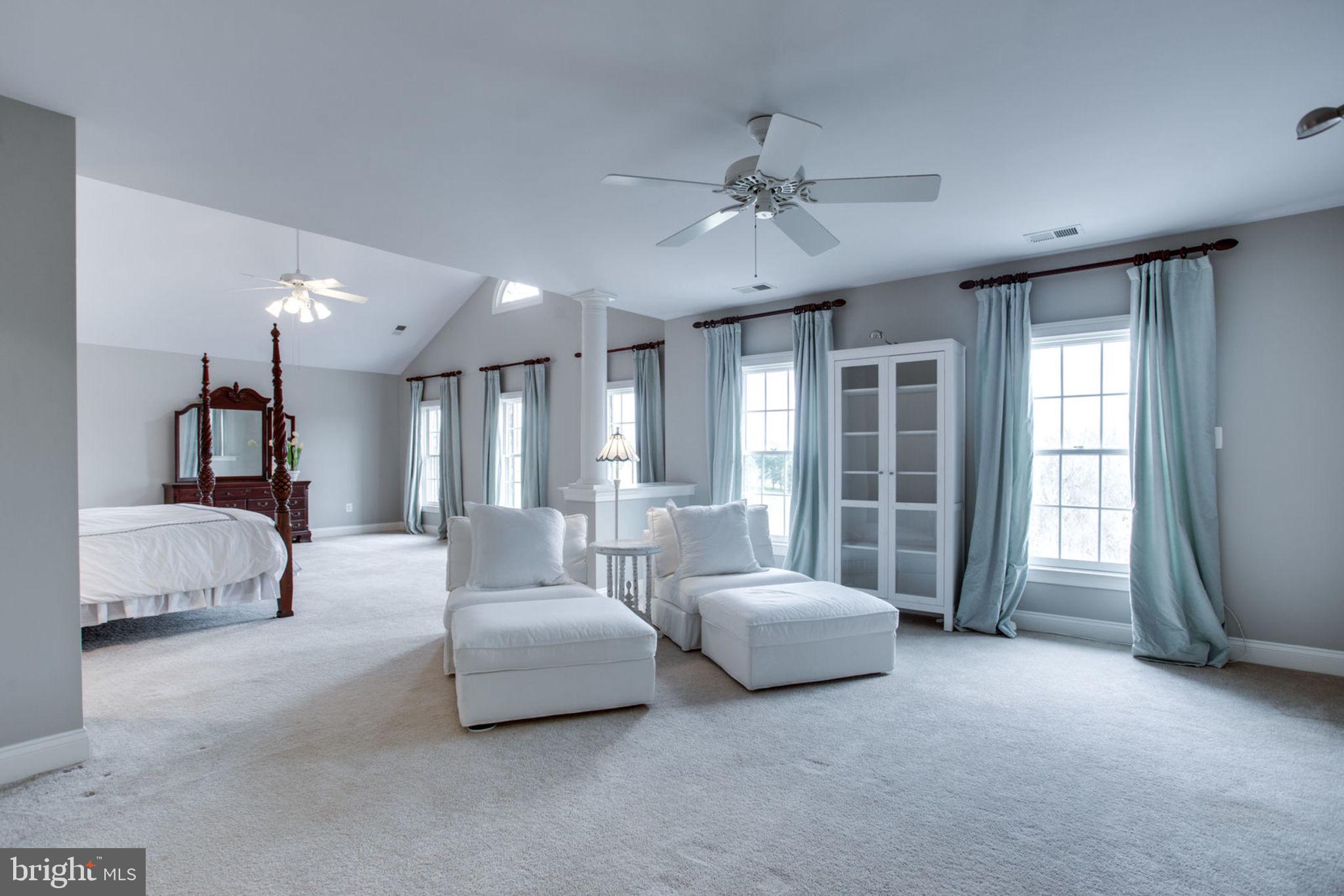18621 Thundercloud Road Boyds, MD 20841 - Photo 37 of 83 a spacious bedroom with bed and a large window