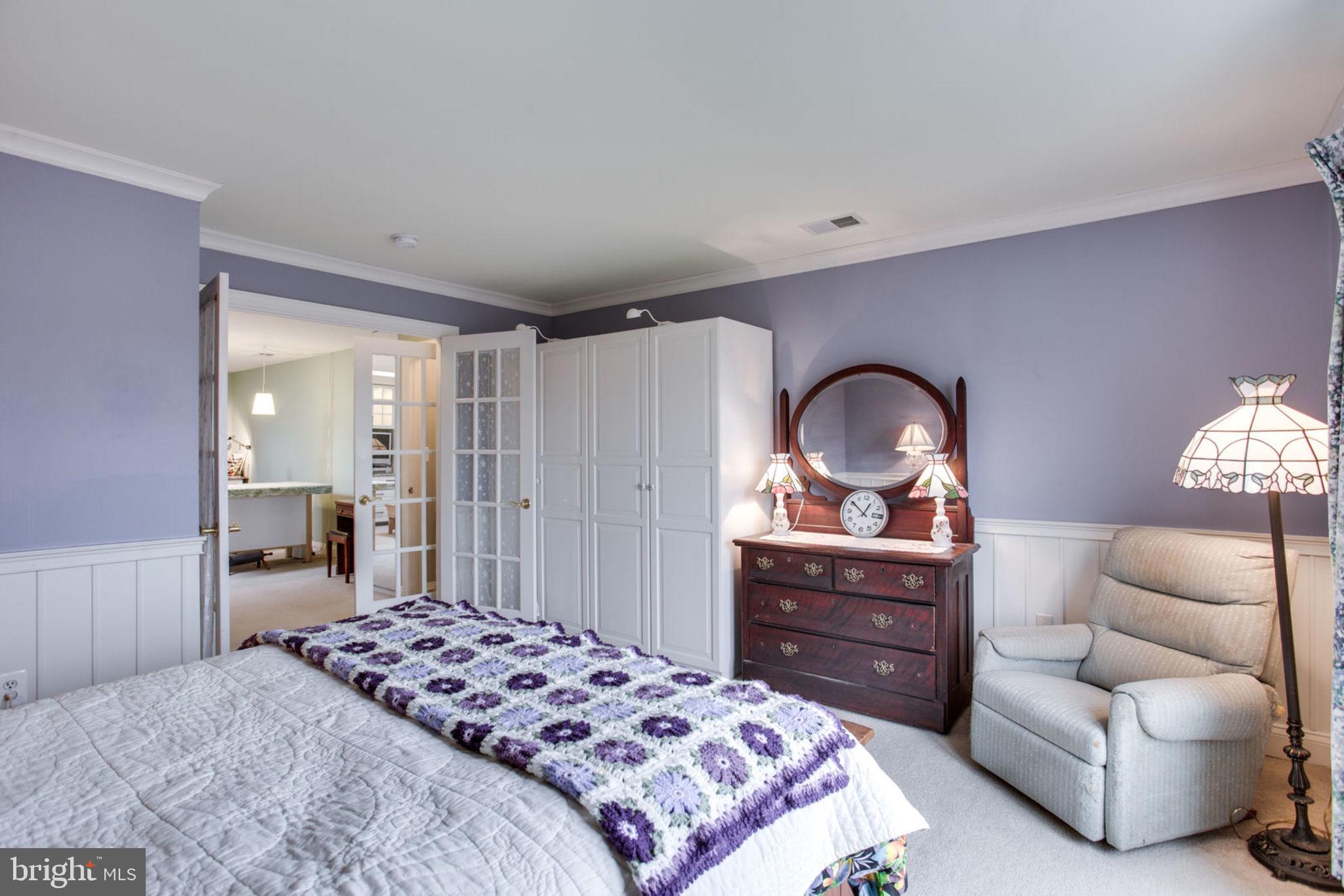 18621 Thundercloud Road Boyds, MD 20841 - Photo 64 of 83 a bedroom with a bed and a dresser