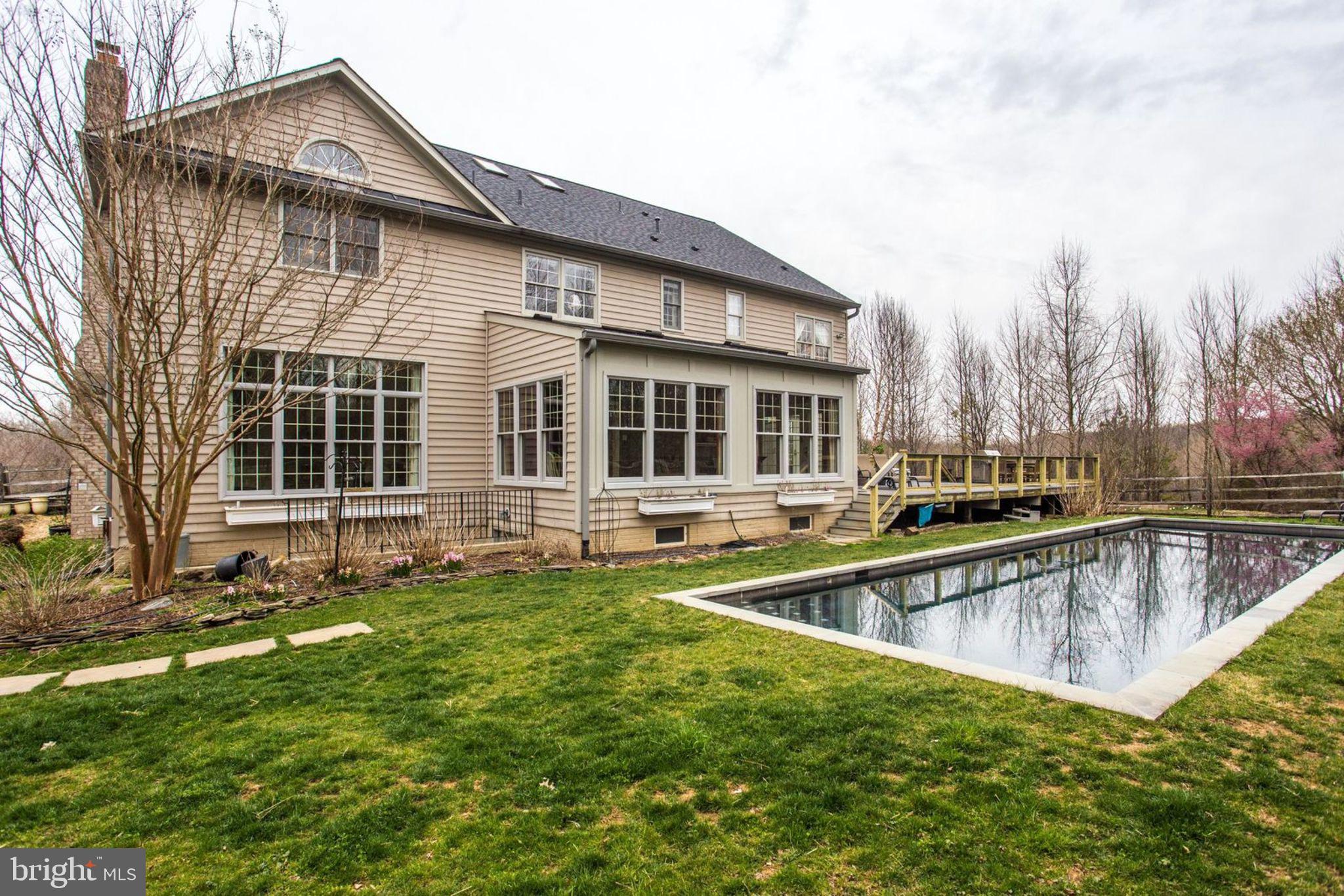 18621 Thundercloud Road Boyds, MD 20841 - Photo 76 of 83 a view of a house with pool and sitting area