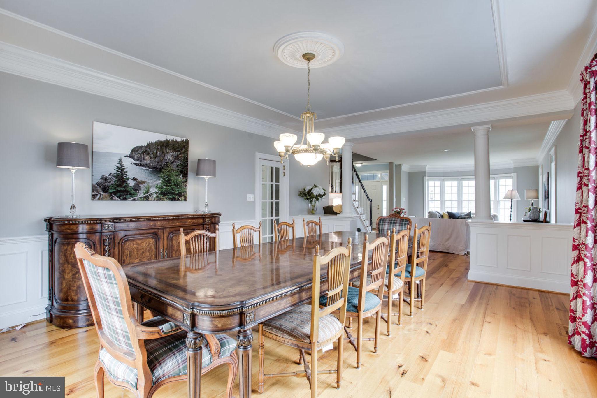18621 Thundercloud Road Boyds, MD 20841 - Photo 10 of 83 a dining room filled chandelier and wooden floor