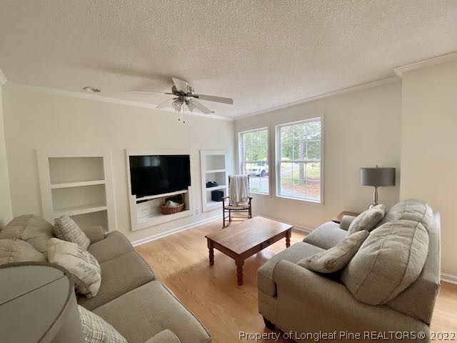 670 Shady Grove Road Carthage, NC 28327 - Photo 4 of 34 a living room with furniture and a flat screen tv