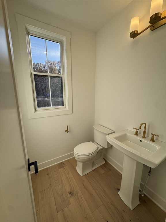 12 Old County Road, Unit 20 Hudson, MA 01749 - Photo 25 of 30 a bathroom with a sink a toilet and a window