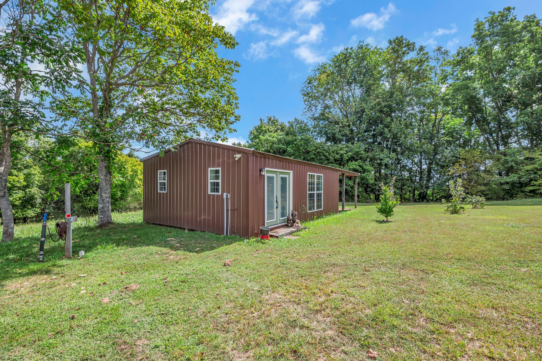 397 West Grinders Switch Road Centerville, TN 37033 - Photo 7 of 48 This tidy cottage has been professionally enclosed and finished out for year-round use.