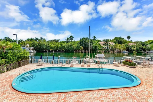 a view of a swimming pool with a patio