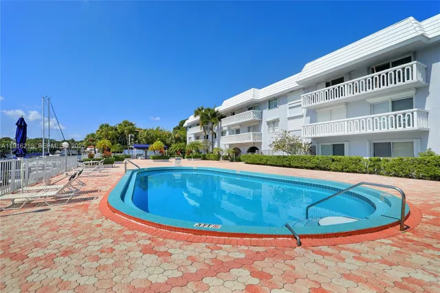a view of swimming pool with outdoor seating