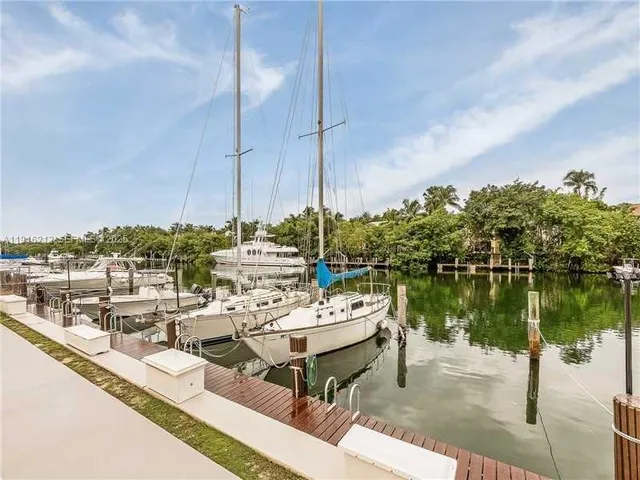 a group of boats are docked in a harbor