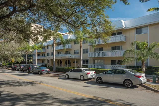 a view of street with parked cars