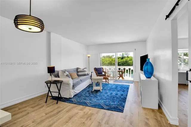 a living room with furniture and a window