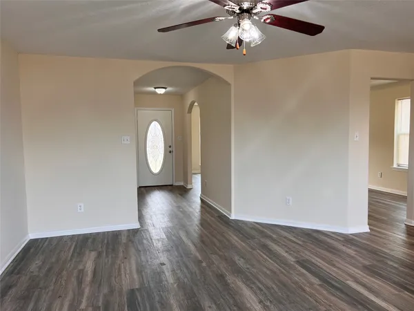 a view of a livingroom with wooden floor