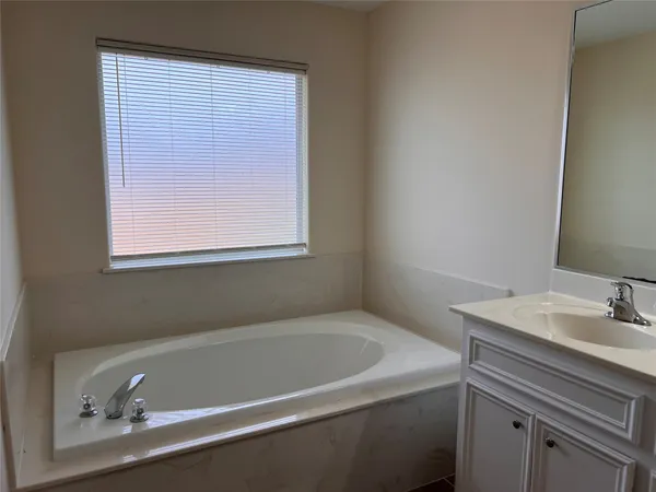 a bathroom with a sink and a bathtub