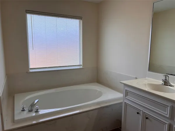 a bathroom with a sink and a bathtub