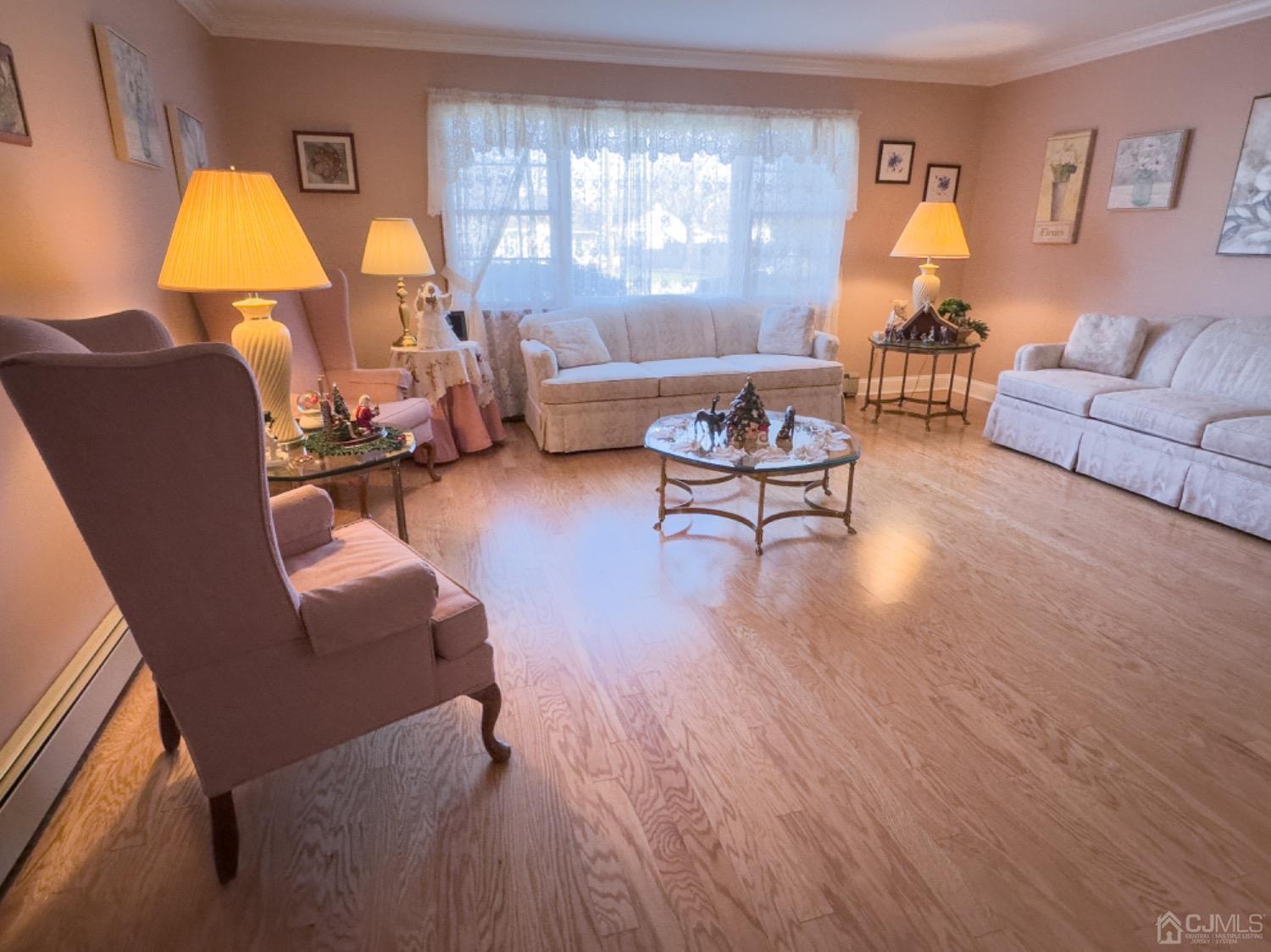 26 Fairfax Road Edison, NJ 08817 - Photo 7 of 29 a living room with furniture a table and a lamp