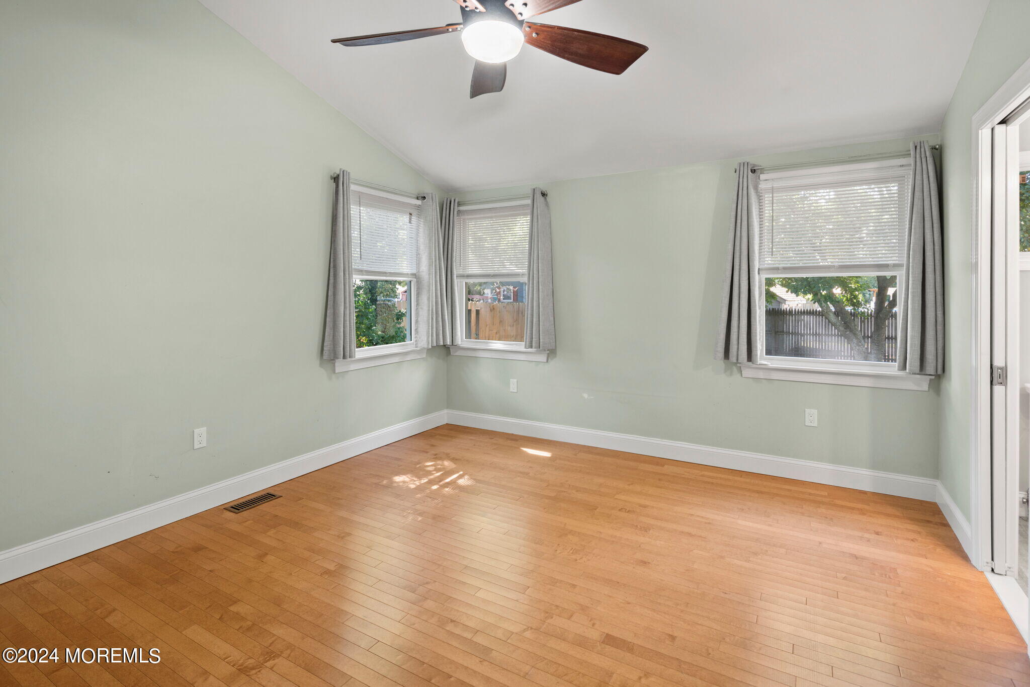 740 Midstreams Road Brick, NJ 08724 - Photo 21 of 31 an empty room with windows and fan