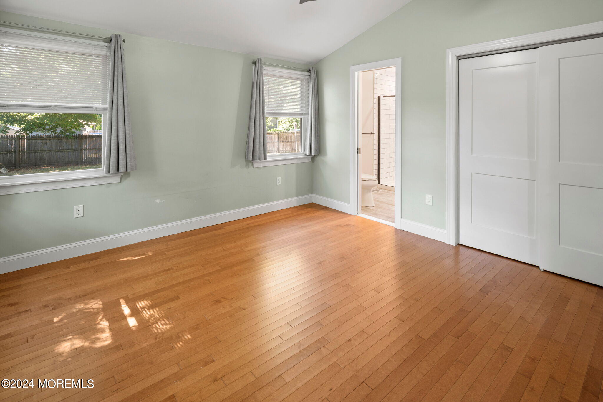 740 Midstreams Road Brick, NJ 08724 - Photo 26 of 31 an empty room with wooden floor and windows