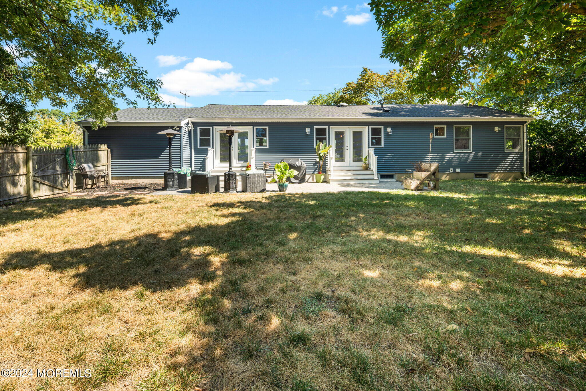 740 Midstreams Road Brick, NJ 08724 - Photo 29 of 31 a front view of a house with a garden and patio