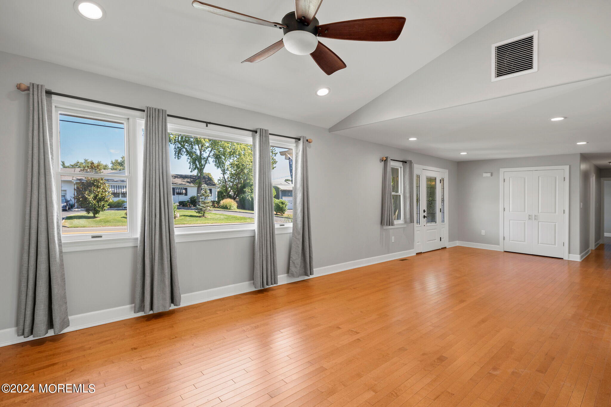 740 Midstreams Road Brick, NJ 08724 - Photo 4 of 31 a view of an empty room with a window and a kitchen view