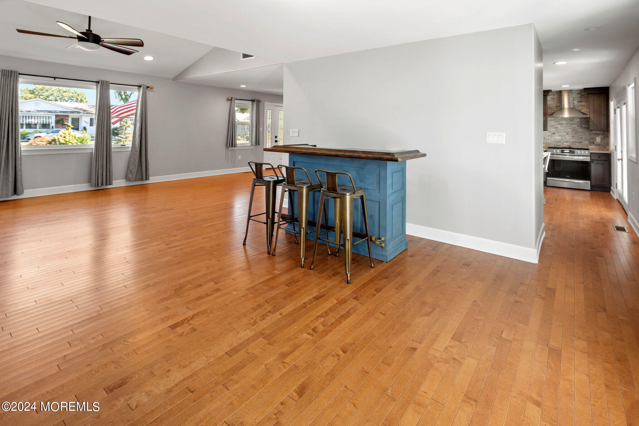 740 Midstreams Road Brick, NJ 08724 - Photo 8 of 31 a view of empty room with wooden floor and a floor to ceiling window