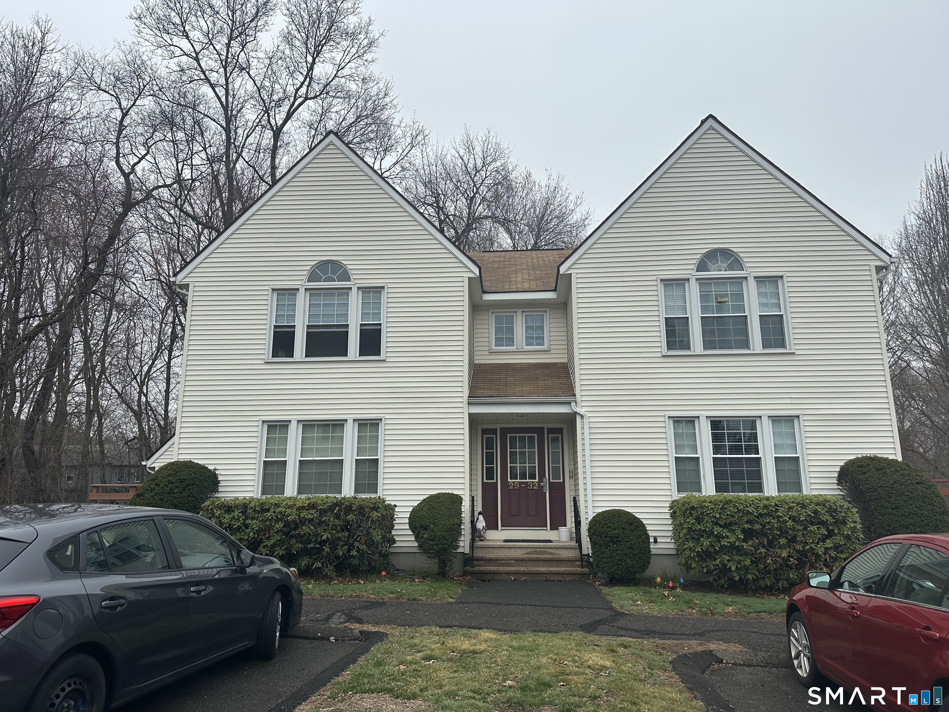 a front view of house with yard and outdoor seating