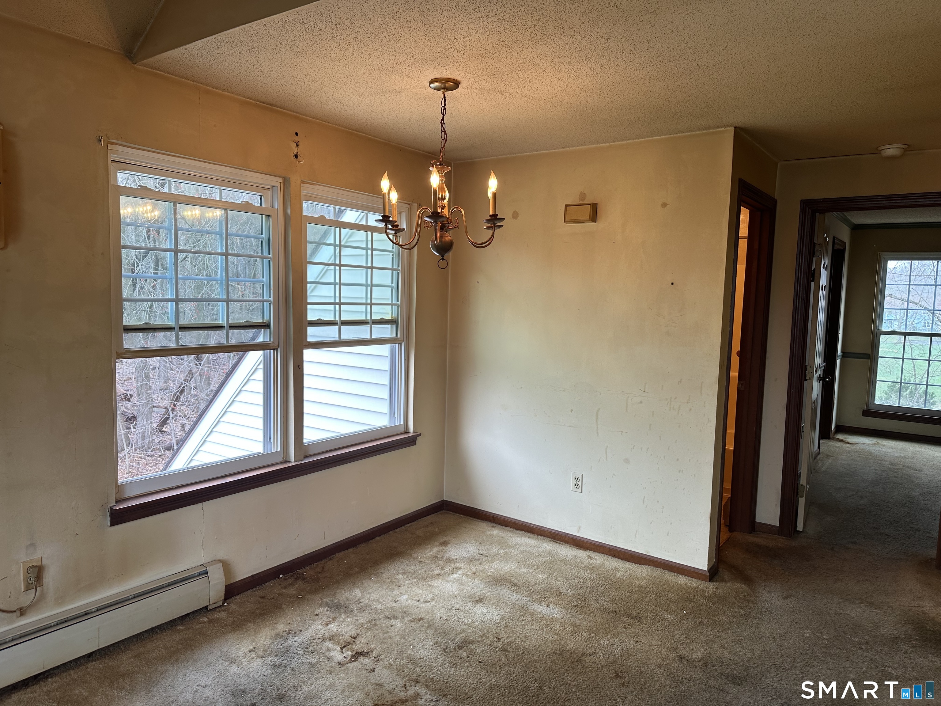 14 Pinney Street, Unit 32 Ellington, CT 06029 - Photo 5 of 14 a view of an empty room with a window