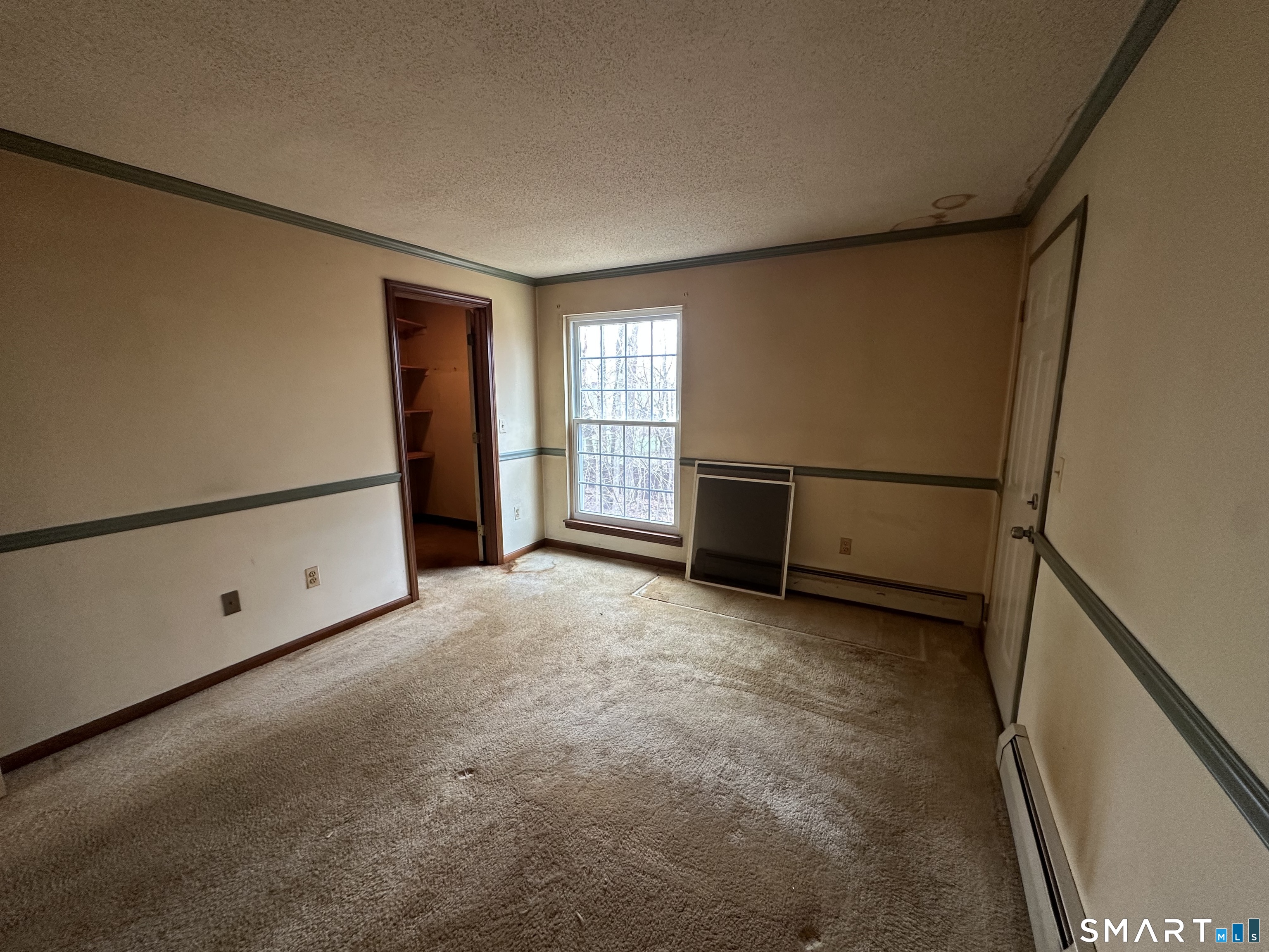 14 Pinney Street, Unit 32 Ellington, CT 06029 - Photo 8 of 14 an empty room with windows