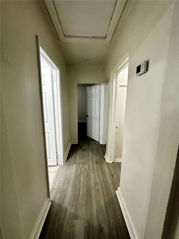 1907 Rio Grande Avenue Orlando, FL 32805 - Photo 6 of 17 a view of a room with wooden floor and a window