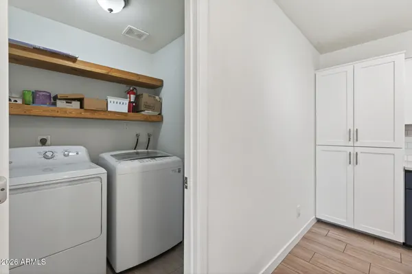 a view of storage and utility room with washer and dryer