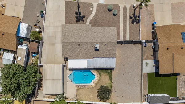 an aerial view of a house with a garden