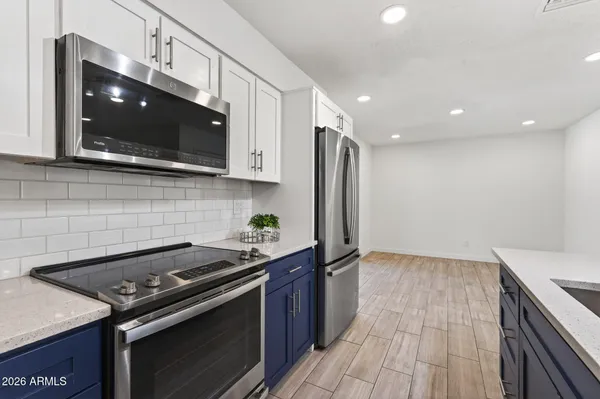 a kitchen with sink and microwave