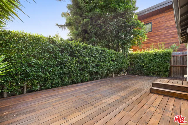 a view of a wooden floor with a yard