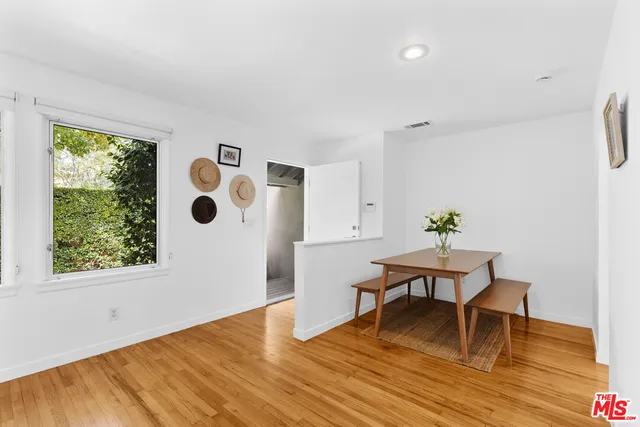 a workspace with furniture and wooden floor