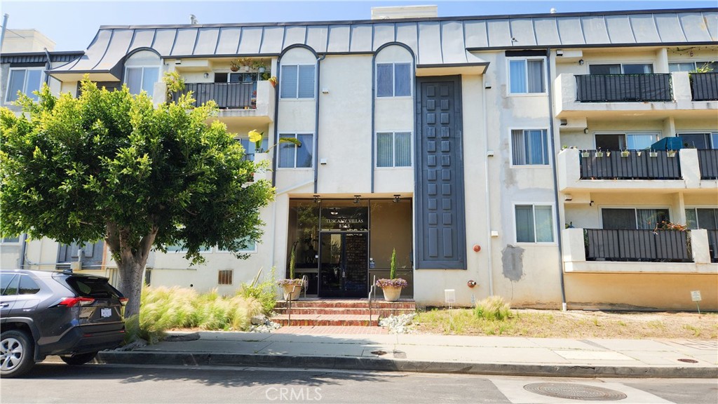 8163 Redlands Street, Unit 32 Playa del Rey, CA 90293 - Photo 1 of 1 a view of a building with a street